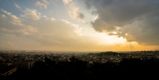 A panoramic shot of a city during the breathtaking sunset