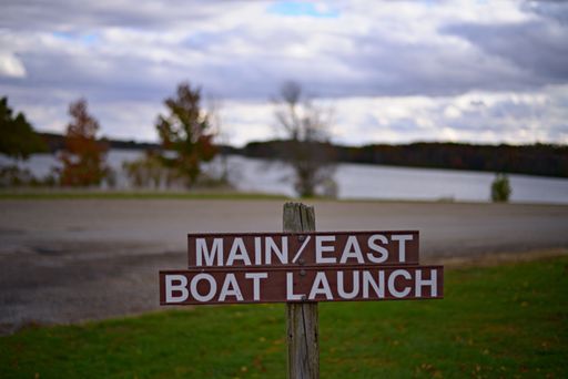 A signboard informing about main east boat launch by the lake