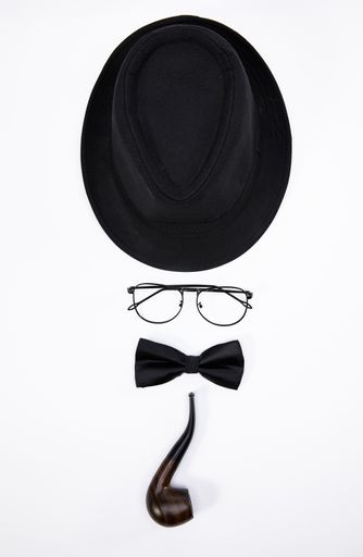 A man formed with a black hat, glasses, bowtie, and smoking pipe isolated on white background