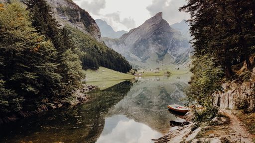 A mesmerizing view of the Santi lake flowing in a mountainous landscape in Switzerland