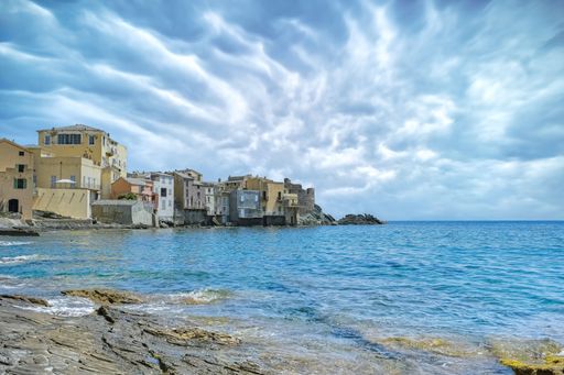 Corsica, Erbalunga, typical houses in the village in summer, on the shore