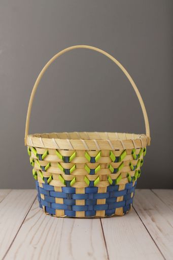 A yellow basket on wooden surface