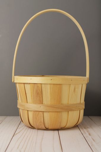 A brown basket on wooden surface