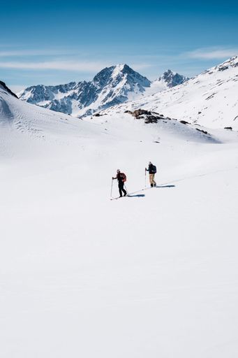 A breathtaking winter scene featuring adventurers in Italy's Val Senales, South Tyrol