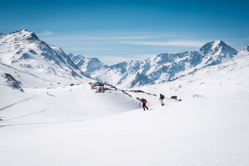A breathtaking winter scene featuring adventurers in Italy's Val Senales, South Tyrol