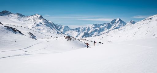 A breathtaking winter scene featuring adventurers in Italy's Val Senales, South Tyrol