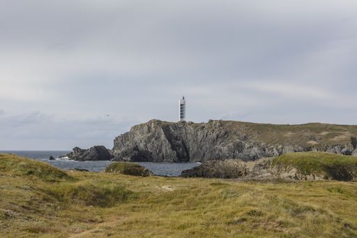 A beautiful shot of a lighthouse on cliffs near the shore of Valdovino, Galicia, Spain