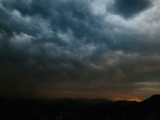 A dramatic sky featuring a blanket of dark storm clouds.