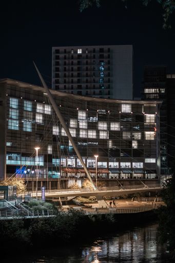 A shot taken by the river  at night displaying the calm essence of Manchester
