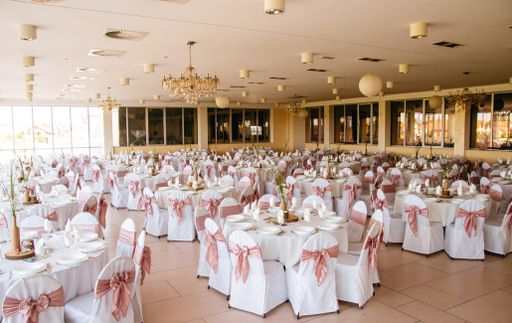 A beautifully arranged indoor wedding venue