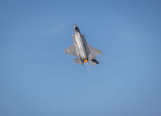 A military fighter jet flying in the sky