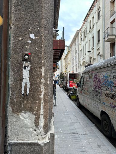 A wall and a van covered in graffitis