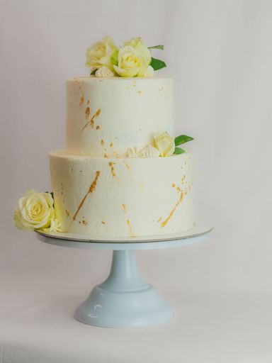 A wedding cake decorated with roses