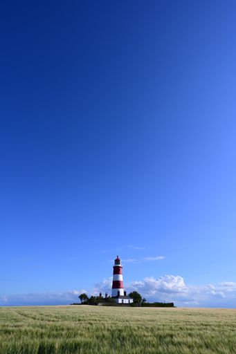 A landscape view of the Happisburgh Lighthouse in Happisburgh, the only independently operated lighthouse in Great Brita