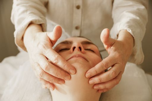 A Caucasian female enjoying her facial massage
