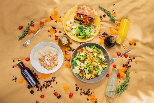A picnic tablecloth with healthy food and drinks