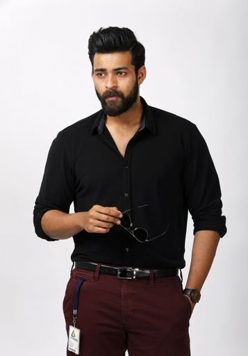Indian young male model stylish pose photo shoot in studio. Hand taken black eye glasses.