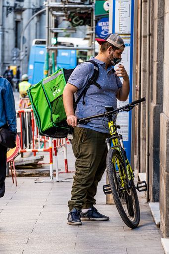 Madrid Spain. April 6, 2021. Bicycle delivery people from online food delivery platforms taking orders around Madrid