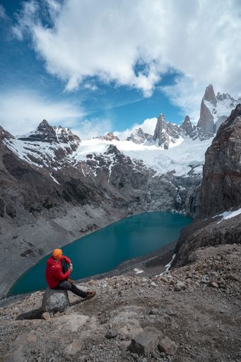 A male on Laguna de Los Tres with Mt Fitz Roy in the background