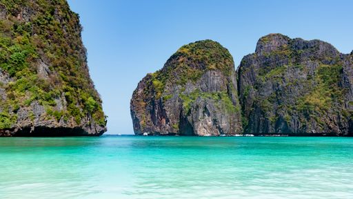 A ccenic view of pure blue sea, boats and distant mountains, Phuket and Phi Phi Island, Thailand