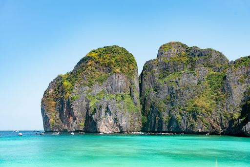 A ccenic view of pure blue sea, boats and distant mountains, Phuket and Phi Phi Island, Thailand