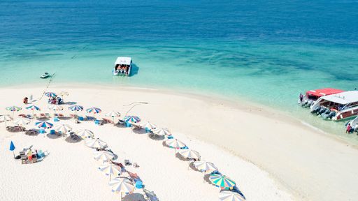 A beach with colorful umbrellas and beach chairs, Phuket and Phi Phi Island, Thailand