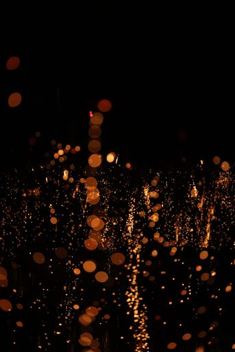 An abstract close-up of bright and radiant lights illuminating the dark