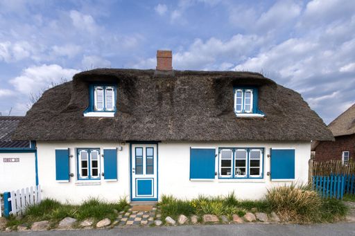 A closeup of a Typical thatched roof house in Nordfriesland on the Nordstrand peninsula Germany,