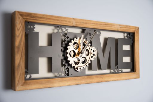 This image features a wooden wall clock with the word "Home" inscribed on it