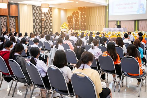 The rear view of college students listening to the lecture in the hall