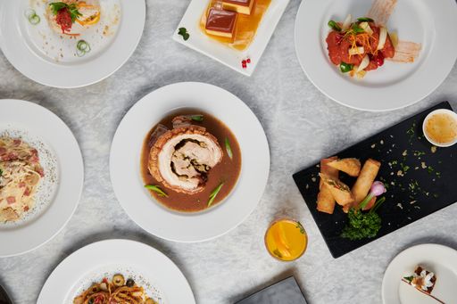 A top view of different decorated dishes served on plates on the table
