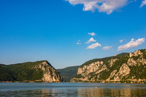 A beautiful view of Danube Gorge (Iron Gates) with clear water and mountain forests under a clear sky