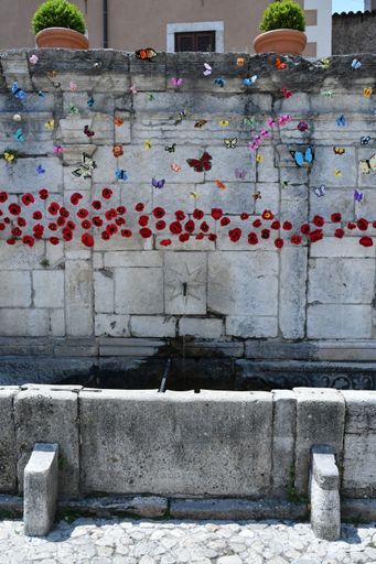 An ancient fountain in a medieval town in the Abruzzo region.