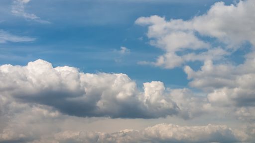A beautiful blue cloudy sky on a sunny day - great for wallpapers and backgrounds