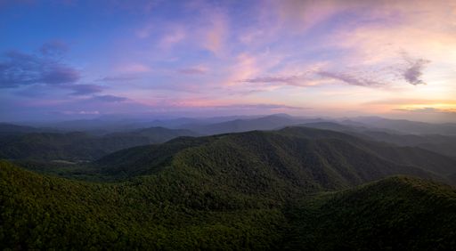 An aerial view of clouds over the Appalachian mountains at sunset.