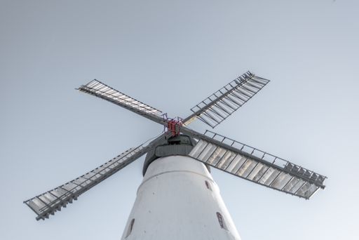 A low angle shot of a windmill against the clear sky
