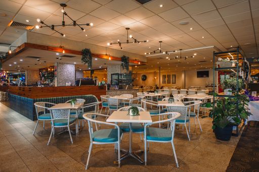 A modern cafe dining room interior with no people present