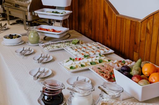 A beautifully decorated catering banquet on a white table in the hotel
