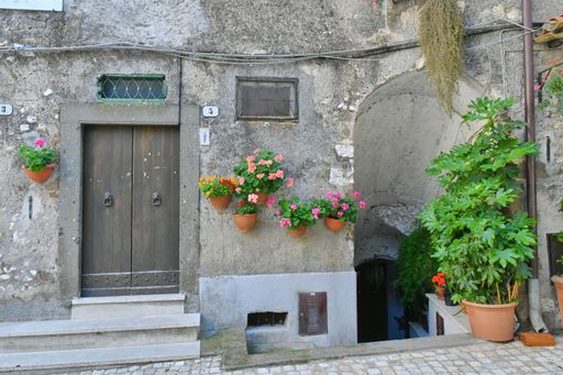 The door of ant old house in a medieval town near Rome.