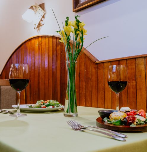 A vertical shot of dinner for two set up at a beautiful table