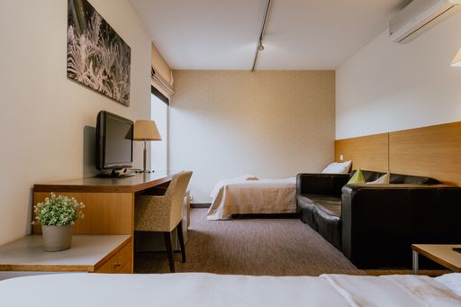 A cozy hotel bedroom with commodities