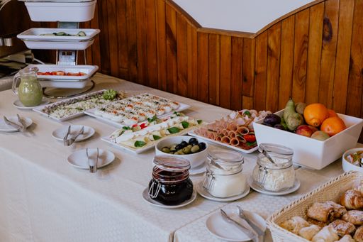 A beautifully decorated catering banquet on a white table in the hotel