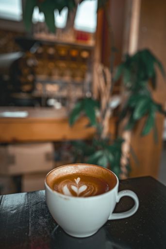 A close p shot of a cup of cappuccino topped with a heart-shaped latte art design, Faroe Islands