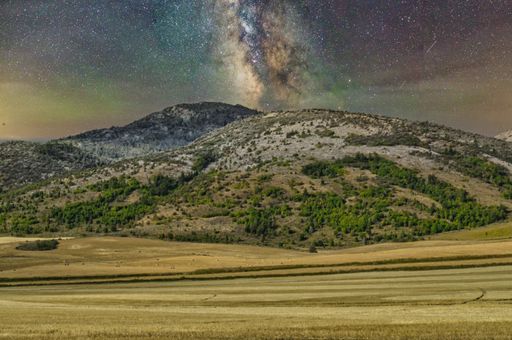 The Milky Way over a mountain field