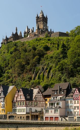 A vertical shot of classic European-style homes situated near Castle Reichsburg in Cochem, Germany