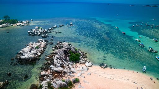 A beautiful view of rocky shore on blue sea