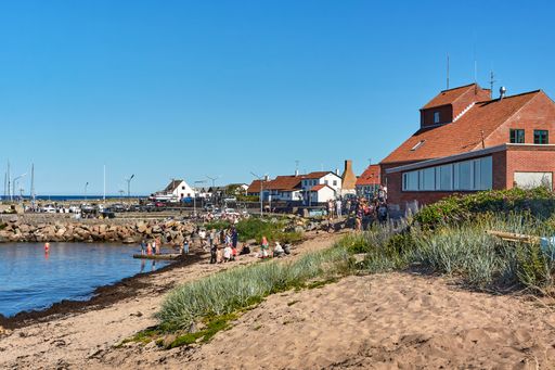 Aarsdale, Bornholm island, Denmark - June 28, 2019. Local people and tourists celebrating official opening of Mikkeller Aarsdale bar and pub.