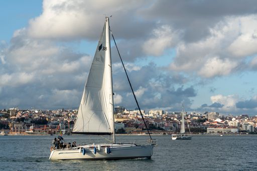 Panoramic view of Lisbon with sailing boats in the foreground