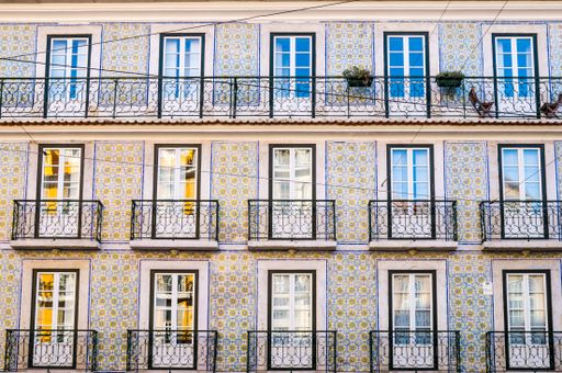 A closeup shot of a colorful building facade in Alfama in Lisbon, Portugal