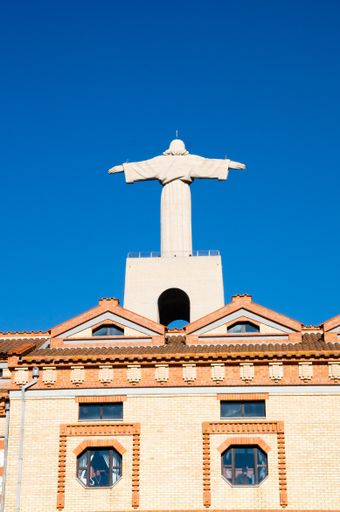 A vertical shot of the Sanctuary of Christ the King in Lisbon, Portugal